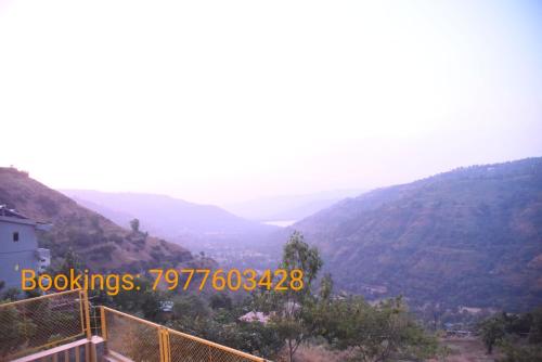 a picture of a valley with mountains in the background at Rozaan Villa Valley View in Mahabaleshwar