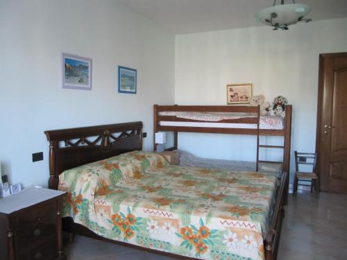 a bedroom with a bed and a bunk bed at Il Portico in Uras