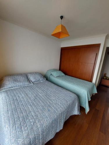 Postel nebo postele na pokoji v ubytování Departamentos Nautilus