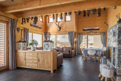 a living room with a table and a couch at Laackerhof in Bettmeralp