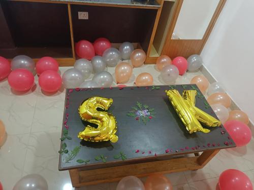 a birthday cake with a number six on top of a table at Sambodhi Retreat in Dhanbād