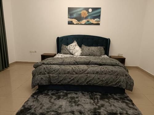 Postel nebo postele na pokoji v ubytování Studio Apartment Ajman