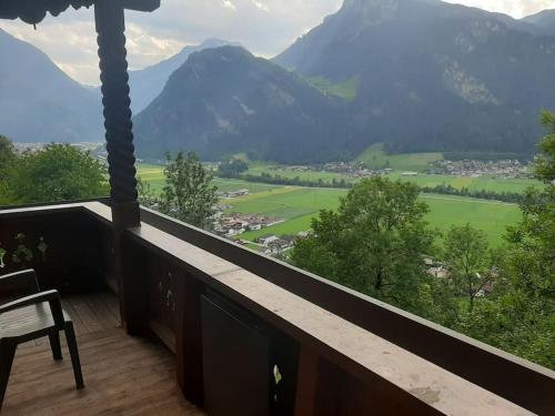 a balcony with a view of a valley and mountains at Alpine cottage with exceptional view in Mayrhofen