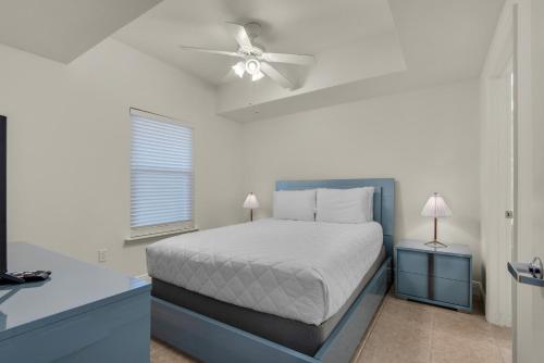 a bedroom with a bed and a ceiling fan at Ariel Dunes I 1705 in Destin