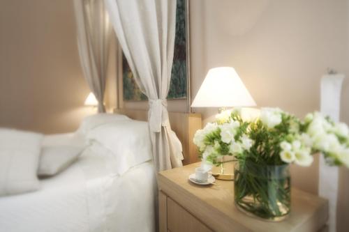 Ένα ή περισσότερα κρεβάτια σε δωμάτιο στο Palazzo Brunaccini Boutique Hotel