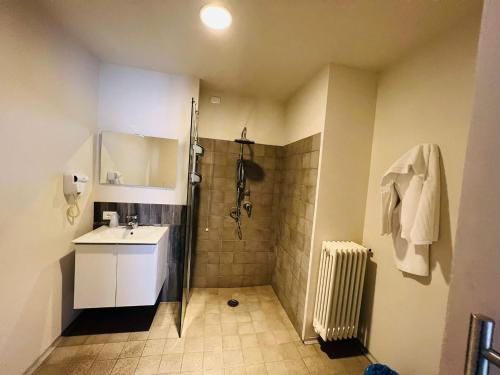 a bathroom with a shower and a sink and a toilet at hotel garni Santa Caterina in Orta San Giulio