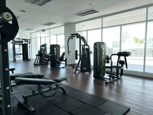 a gym with treadmills and machines in a building at Kuching Tabuan Tranquility Apartment TT3 Soho C11 in Kuching