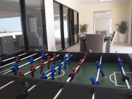 a table with a bunch of toy figures on it at Edge Apartments Cairns in Cairns