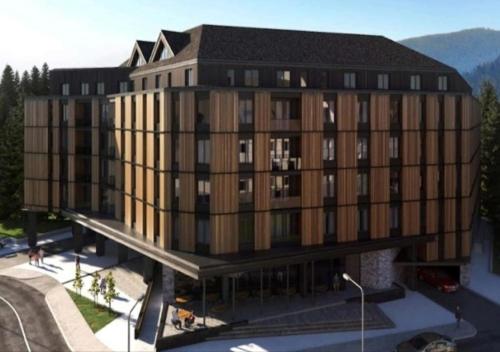 una rappresentazione architettonica di un edificio di grandi dimensioni di Kopaonik011 Konaci&WoodSide Apartments a Kopaonik