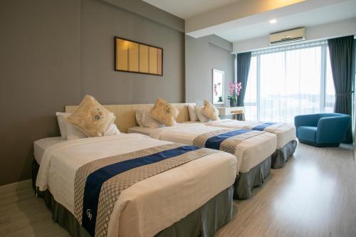 Postel nebo postele na pokoji v ubytování Sky Hotel
