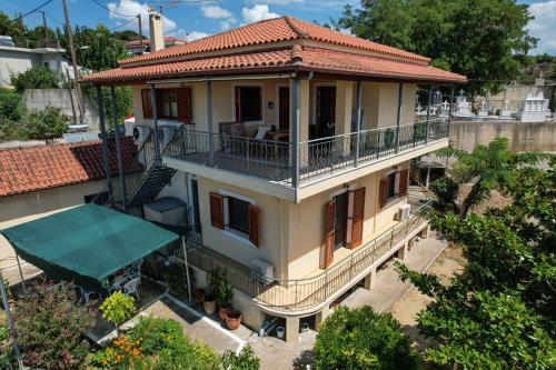 an image of a house with a balcony at Villa Koliri in Pýrgos