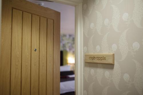 a room with a door and a sign on the wall at The Green House in Bournemouth
