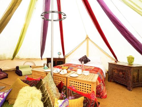 a room with a bed and a table in a tent at Bedouin - Ukc5929 in Highclere