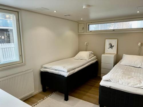 Postel nebo postele na pokoji v ubytování City Apartment Ilmola