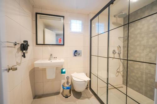 Koupelna v ubytování Hotel Amore