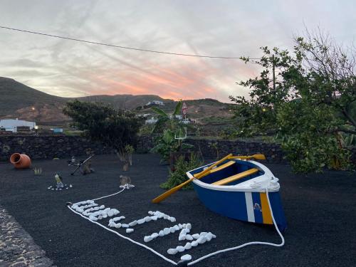 a blue boat sitting on the ground with a rowanship at Club JM Lanzarote in Tabayesco