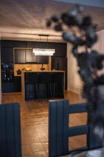 a kitchen with a island in the middle of a room at Moonlight Hill Point in Deal
