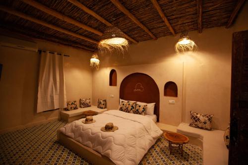a bedroom with a large bed in a room at Aghmat Lodge Guest house in Marrakech