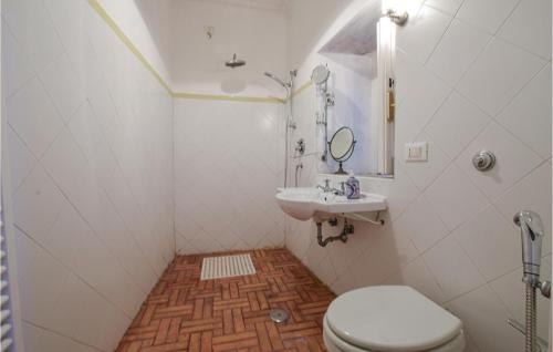 a bathroom with a toilet and a sink at Artists Flat in Amantea