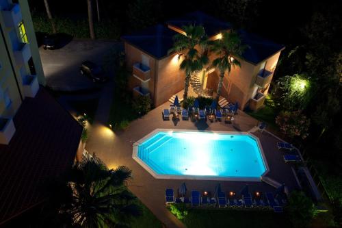 an overhead view of a swimming pool at night at Hotel Venezia in Marina di Pietrasanta