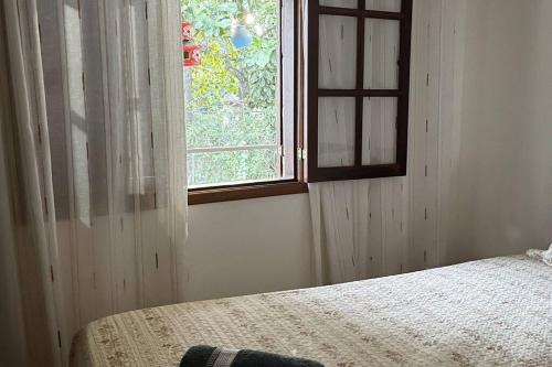 Кровать или кровати в номере Casa Duplex em Cabo Frio - pertinho de tudo!