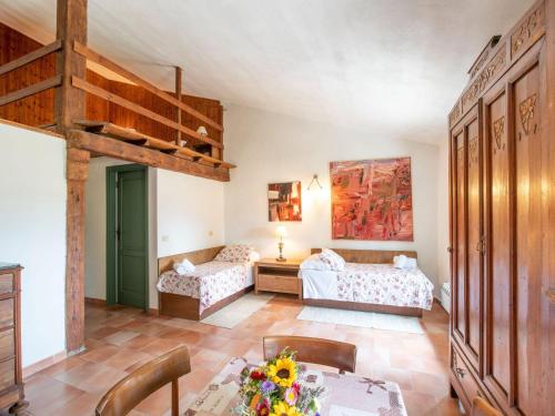 a living room with a loft bed and a bedroom at Apartment near Pisa, Beaches in Guasticce