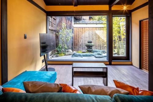 a living room with a view of a garden at GION KAWASEMI in Kyoto