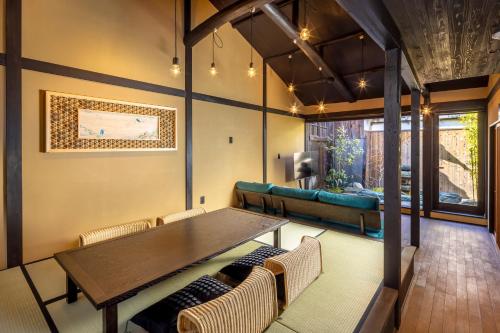 a dining room with a table and chairs at GION KAWASEMI in Kyoto