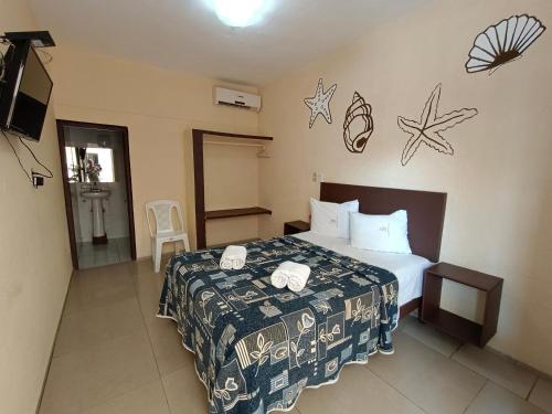 Una cama o camas en una habitación de Hotel Playa de Oro - Enfrente de WTC y Plazas Comerciales