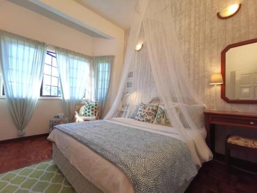 Ένα ή περισσότερα κρεβάτια σε δωμάτιο στο My Garden Cottage @ 花の屋