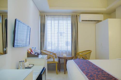 Ένα ή περισσότερα κρεβάτια σε δωμάτιο στο Hotel Shuktara Dhaka