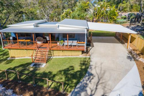an aerial view of a house with awning at Little Mountain Retreat in Caloundra
