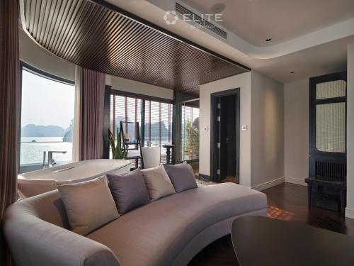 a living room with a couch and a tub at Elite of the Seas in Ha Long