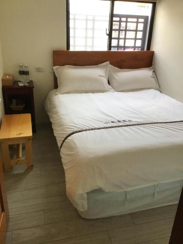 Cama o camas de una habitación en 小魷魚輕旅