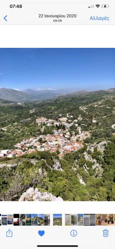 a screenshot of a picture of a town from an airplane at Costas Inn in Spílion