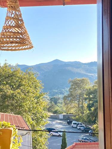 a view from a window of a parking lot at Costas Inn in Spílion