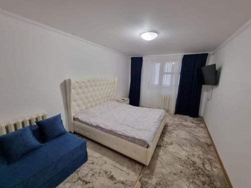 Un pat sau paturi într-o cameră la Apartament 1 camera