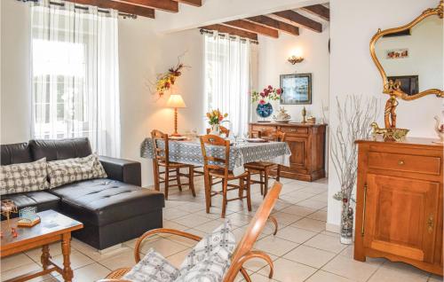a living room with a couch and a table at Holiday Home Rue Jarl Priel in Plouguiel
