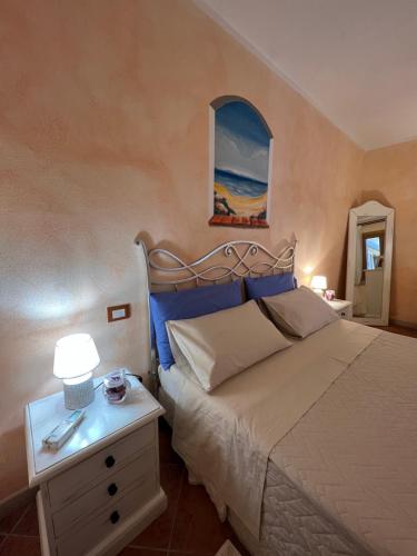 En eller flere senger på et rom på Smeralda Home Sweet Porto Rotondo
