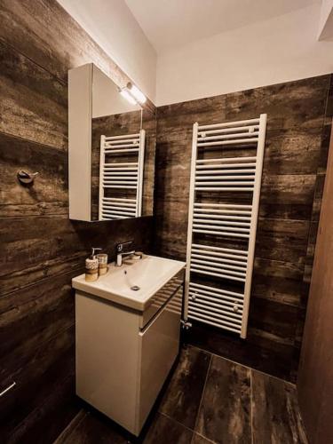 a bathroom with a sink and a mirror at Escala Luxury Loft 2 in the center &Free Parking in Volos