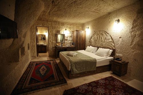 Postel nebo postele na pokoji v ubytování Nox Cave Hotel Special Class
