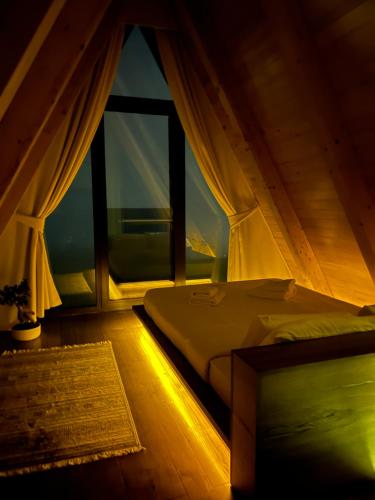 מיטה או מיטות בחדר ב-Masarotto Luxury Chalet #2