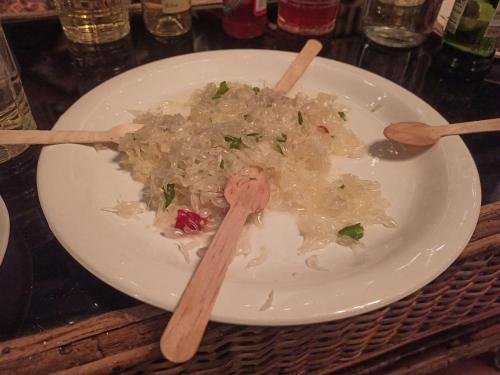 a plate of rice and chopsticks on a table at Assam Villa - by Storyweavers Retreat in Jorhāt
