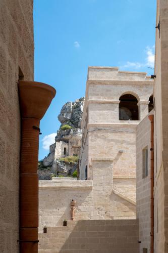 a view of a building with a mountain in the background at PIANELLE RESORT in Matera