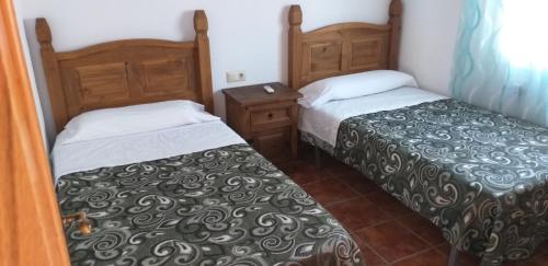 Postel nebo postele na pokoji v ubytování Los Castros