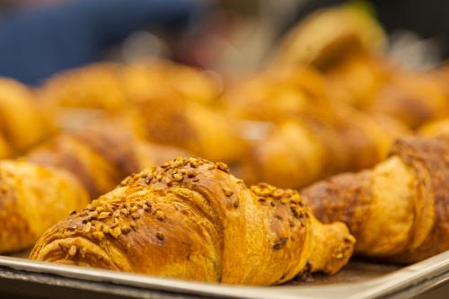 a bunch of pastries sitting on a tray at Hotel Lago di Braies in Braies