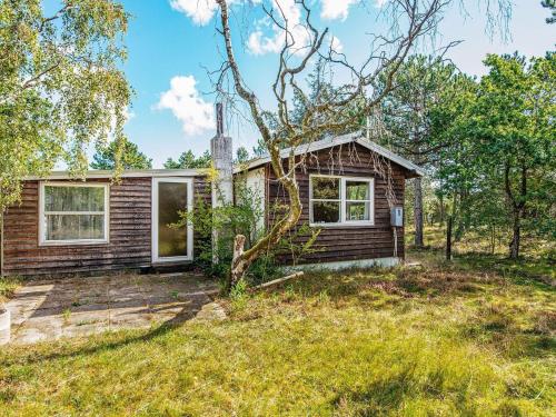 a small house in the woods with a yard at 4 person holiday home in Ebeltoft-By Traum in Ebeltoft