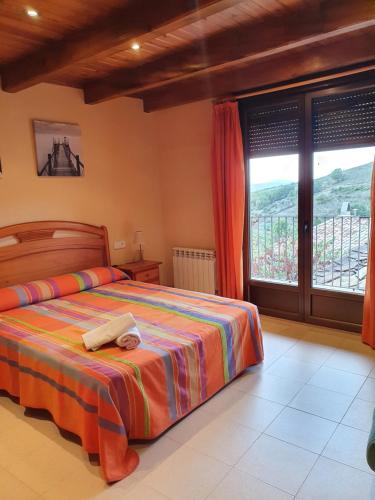 Posteľ alebo postele v izbe v ubytovaní Allotjament Rural Casa Bernat