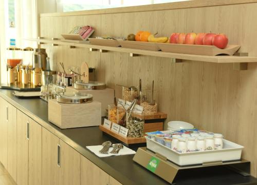 a kitchen with a counter with food on it at Hotel Villa am Rhein in Andernach