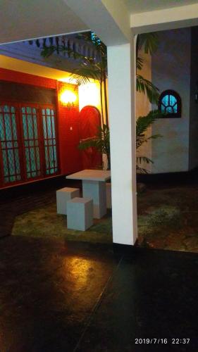 a room with a white table in a building at Ceylon Travel and Stay Lodge in Battaramulla